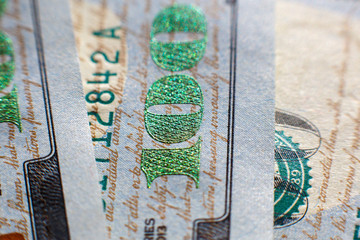 Close-up view on one hundred dollar bill. Macro view on one hundred dollar banknote