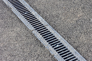 August 1, 2018. Krasnoyarsk. Russia. Improvement of the embankment of the Yenisei River. cast iron grid for water flow in sewers.