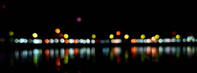 Light night at city bokeh blur abstract background. Blue black focus flare