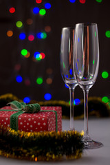 Christmas decoration with two glasses and lights.