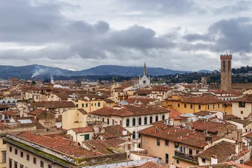 Deurstickers top view of the red tiled roofs of the italian city of Florence © westermak15