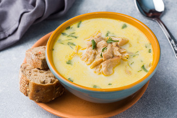 Pink salmon fish soup with cream in a ceramic bowl.