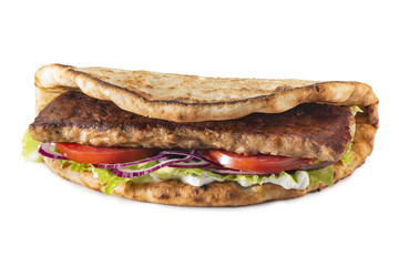 Greek pita with meat, salad, tomato and sauce isolated on white