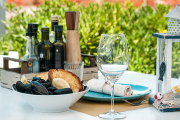 Italian cuisine black mussels with crispy bread