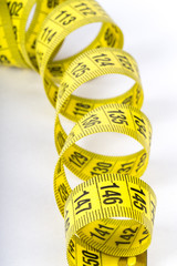 Measuring tape of the tailor for you design. On white background