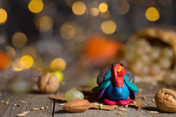 Handmade turkey on Thanksgiving background with blurred night lights.