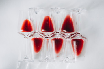 Glasses of red  wine  on white background, flat lay, copy space.  Wine degustation concept