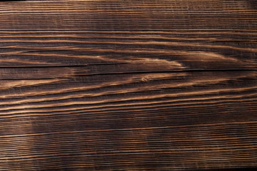 An old board with knots and chips. Wood. Background. Selective focus