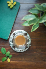 coffe in vintage turkish cup on wooden background top view