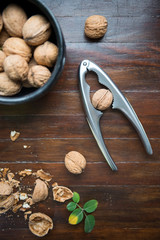 whole walnuts on wooden background top view healthy concept