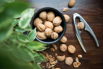 whole walnuts on wooden background top view healthy concept