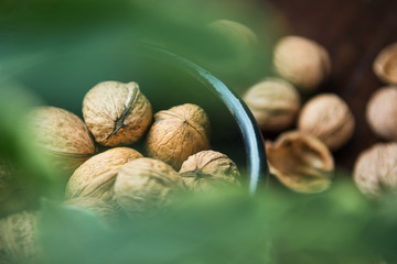 whole walnuts on wooden background top view healthy concept