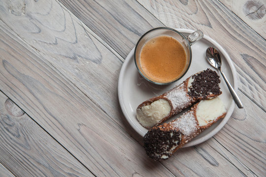 Italian Cannoli With Cup Of Coffee.