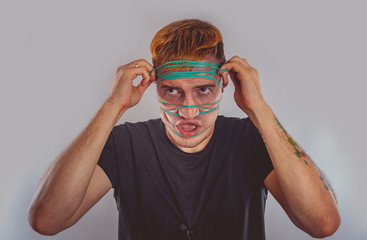 emotional portrait of a crazy guy in close-up. concept: the nervous breakdown, mental disease,...
