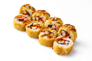 Obraz na płótnie Canvas Closeup japanese hot tempura sushi rolls with crab and teriyaki sauce isolated at white background.