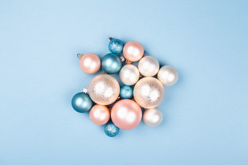 Christmas composition made of Christmas balls on blue background. Minimal New year concept.