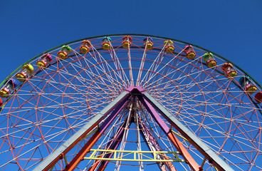 Ferris Wheel at Fun Fair. Carousel.