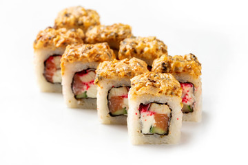 Japanese sushi rolls with eel, salmon, cream cheese and tamago isolated at white background.