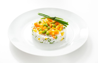 Rice with vegetables in a plate on a white background