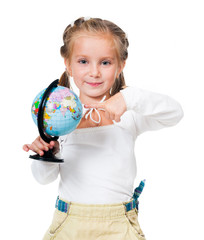 Fototapeta premium Adorable little girl with globe isolated on a white background