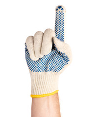 Worker showing gesture - pointing up finger, giving the number one sign. Male hand wearing working cotton glove with blue rubber dots, isolated on white background.