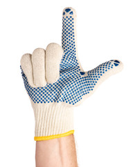 Worker showing gesture - two fingers, gun sign. Male hand wearing working cotton glove with blue rubber dots, isolated on white background.