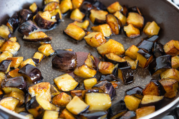 Eggplant fried in a pan close-up