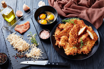 grated potato and cheese crusted meat chops