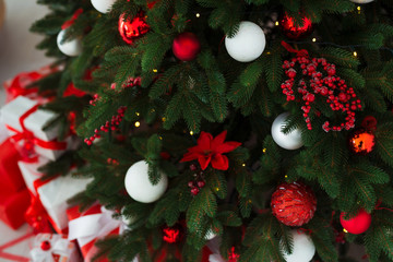 Christmas background. Interior room decorated in xmas style. No people. New year tree and gifts