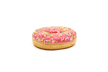 Pink donut with colorful sprinkles isolated on white background.