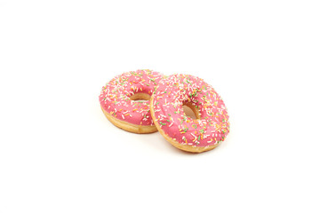 Pink donut with colorful sprinkles isolated on white background.