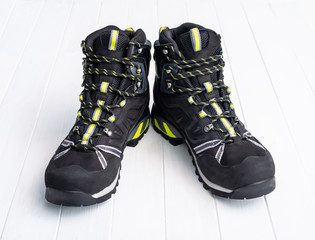 Black hiking boots on the white table