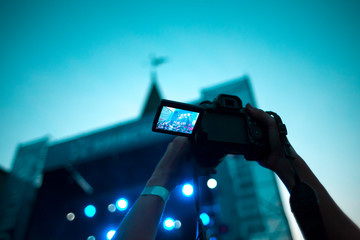 Fototapeta na wymiar Shooting a concert on a smartphone.
