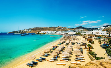 Obraz premium Sandy beach with umbrellas and sun loungers