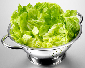 ICEBERG LETTUCE LEAVES IN COLANDER
