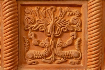 Fototapeta na wymiar Traditional russian ornament on clay oven tiles
