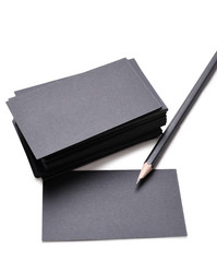 black business cards with pencil isolated on a white background