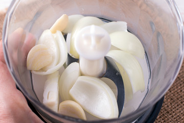 Onions for borsch in an electric chopper