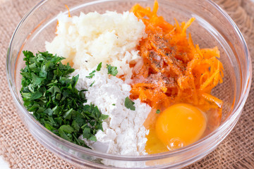 Grated pumpkin in a bowl with the flour