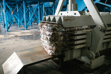 Special equipment for pressing paper waste at a waste sorting plant for further disposal or...