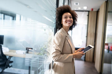 Portrait of a happy young african business woman smiling