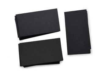 horizontal and vertical stacks of black business cards isolated on a white background