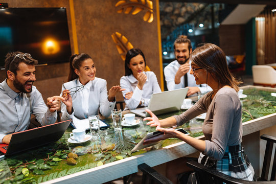 Young Business People Meeting At A Cafe