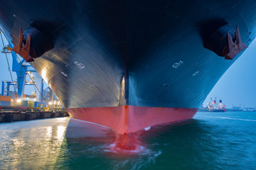 container ship close - up. Part of large merchant ship. Bulb