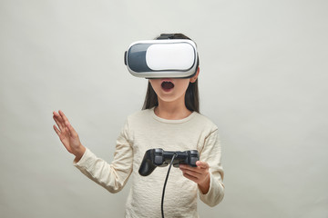 Smiling girl with glasses of virtual reality