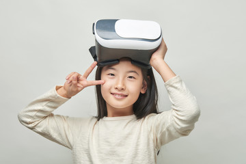 Smiling girl with glasses of virtual reality