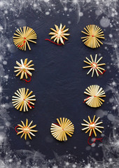Christmas decoration on dark frozen background with stars.