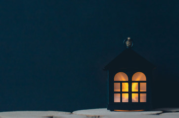 Christmas decoration on the tree in dark colors.