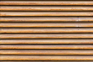 Parallel wooden slats texture. Wooden blinds, as an element of decor. Interior ventilation.  Wood background, close up.