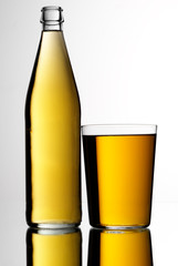 BOTTLE AND GLASS OF APPLE CIDER